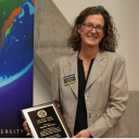 Dr. Rachel Shinnar holds a plaque during App State's Global Leadership Awards Ceremony